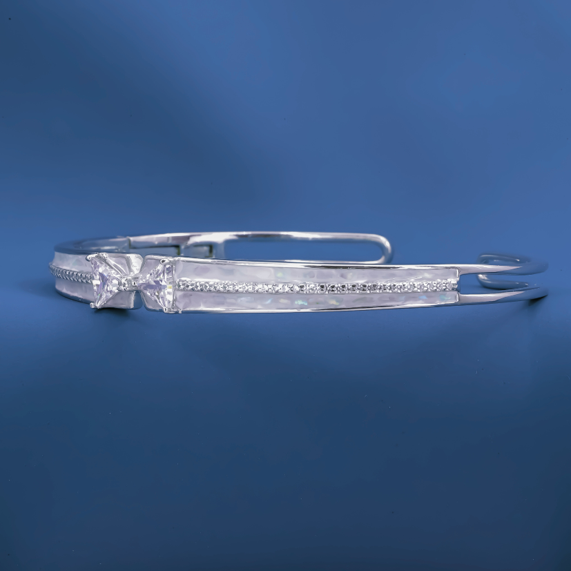 Radiant Bow-Twist Bangle – Sterling Silver Cuff Bracelet
