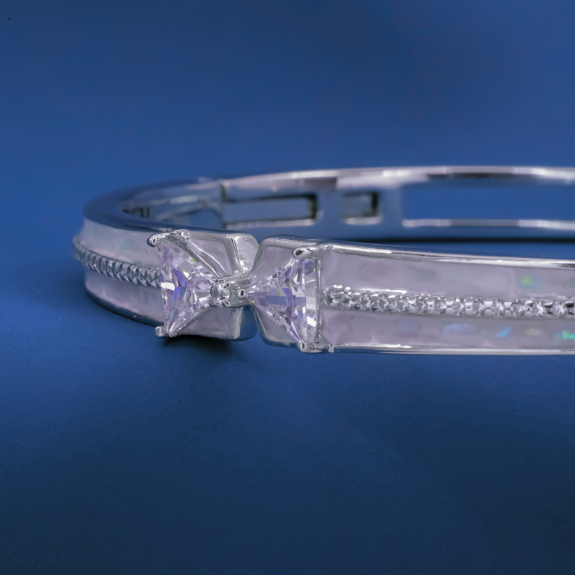 Radiant Bow-Twist Bangle – Sterling Silver Cuff Bracelet