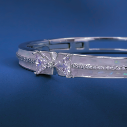 Radiant Bow-Twist Bangle – Sterling Silver Cuff Bracelet