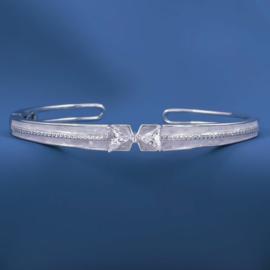 Radiant Bow-Twist Bangle – Sterling Silver Cuff Bracelet