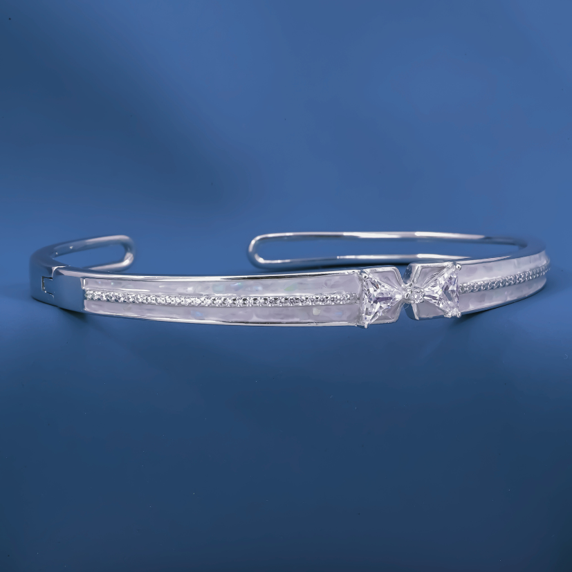 Radiant Bow-Twist Bangle – Sterling Silver Cuff Bracelet